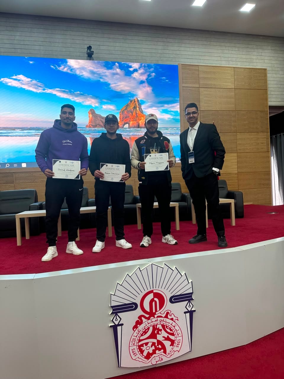 Participants receiving certificates at the SECOPS x Aramon CTF.